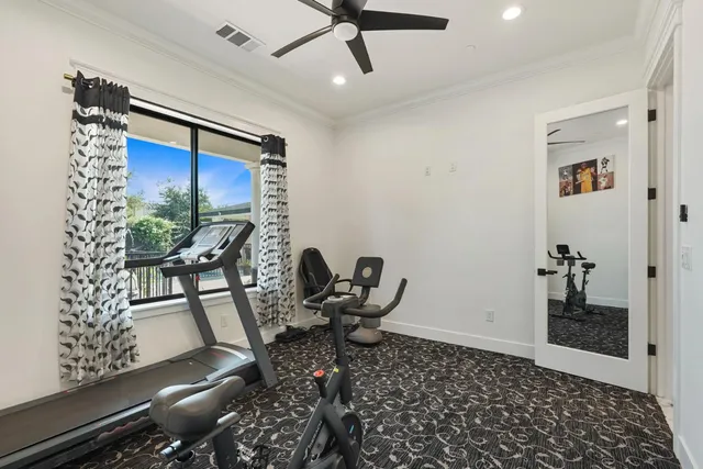 a kitchen with granite countertop white cabinets and sink