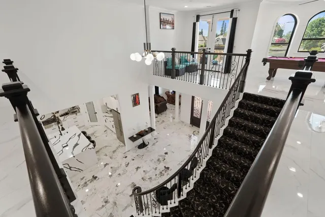 a patio with glass top table and chairs