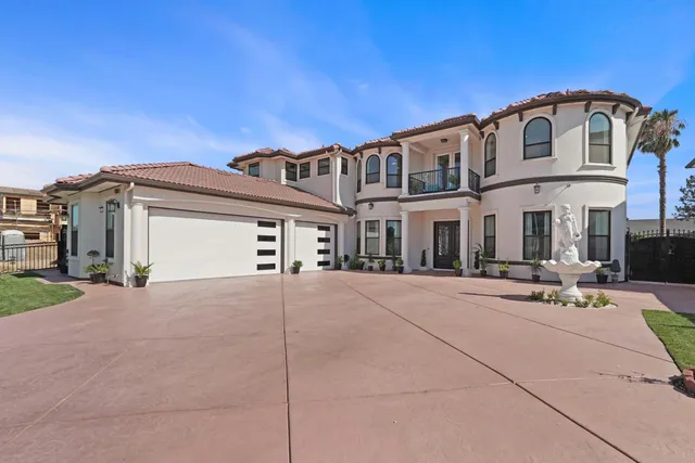a kitchen with white cabinets and refrigerator