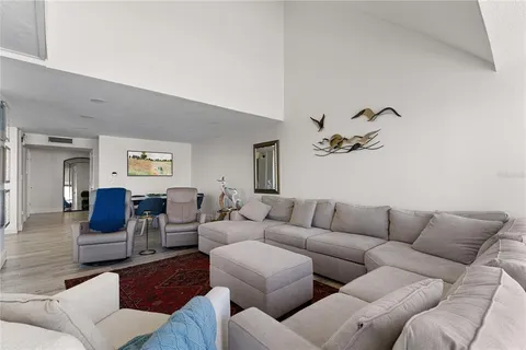 a kitchen with stainless steel appliances kitchen island granite countertop a stove a sink and a refrigerator