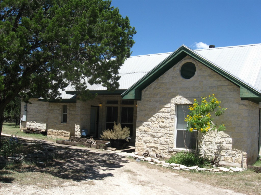 1001 Springlake Drive Dripping Springs, TX 78620 - Photo 1 of 1 a front view of a house with garden