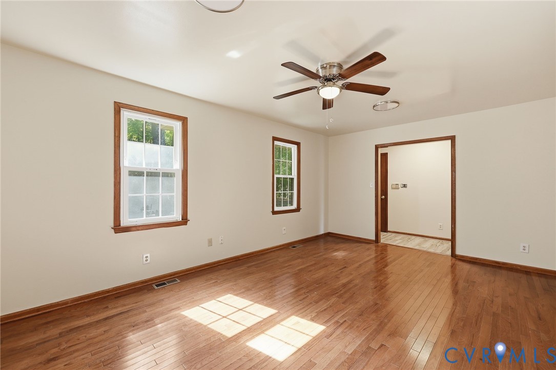 2521 Fort Lee Road Petersburg, VA 23805 - Photo 17 of 27 a view of an empty room with wooden floor and a window