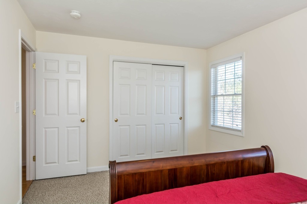 41 Boston Road, Unit 124 Billerica, MA 01862 - Photo 11 of 18 a bedroom with a bed and a window