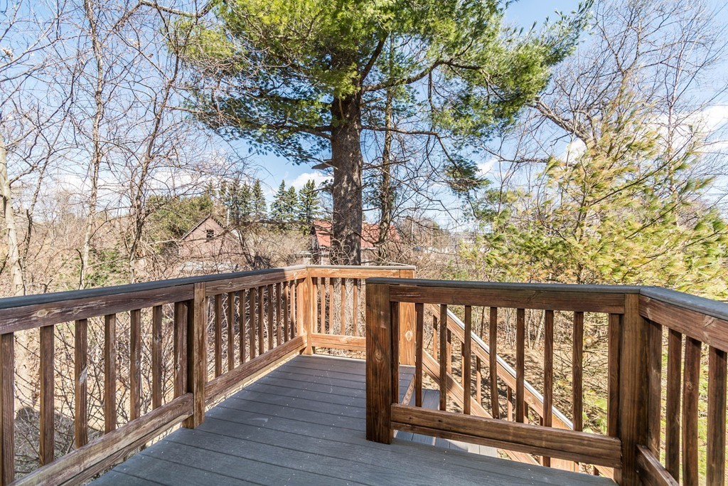 41 Boston Road, Unit 124 Billerica, MA 01862 - Photo 18 of 18 a view of a balcony with wooden fence and floor