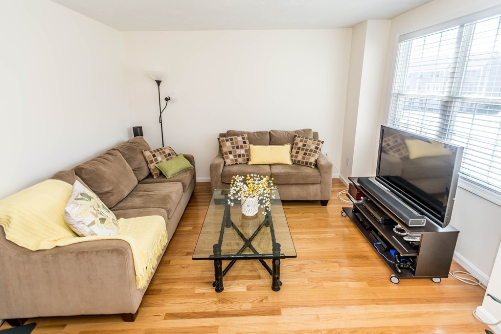 41 Boston Road, Unit 124 Billerica, MA 01862 - Photo 3 of 18 a living room with furniture and a flat screen tv