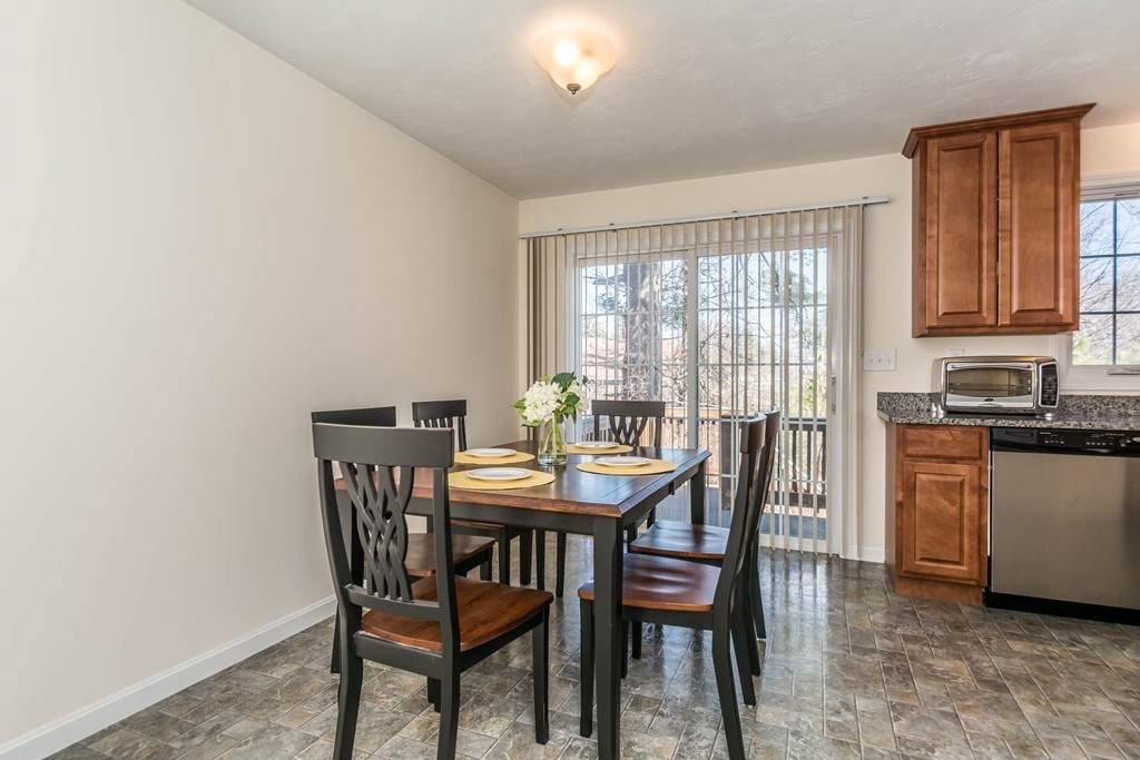 41 Boston Road, Unit 124 Billerica, MA 01862 - Photo 7 of 18 a view of a dining room with furniture and a window