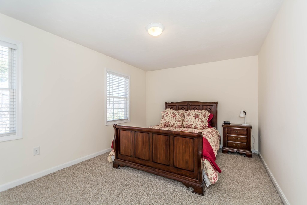 41 Boston Road, Unit 124 Billerica, MA 01862 - Photo 10 of 18 a bedroom with a bed and a window