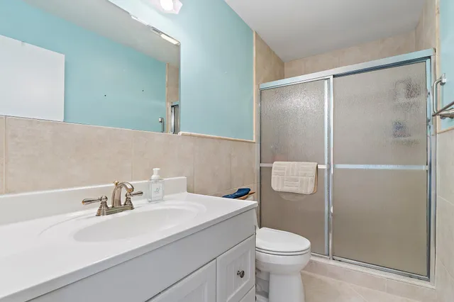 a bedroom with a bed and a desk