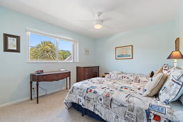 a bedroom with a bed and a lamp