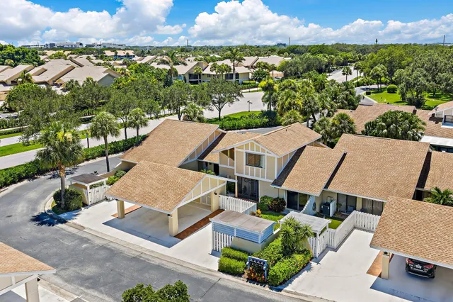 an aerial view of a golf course with parking space