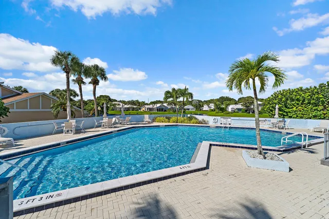 a view of an roof deck with a lake