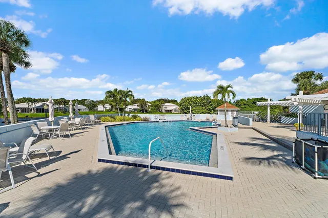 a view of balcony with wooden floor and outdoor seating
