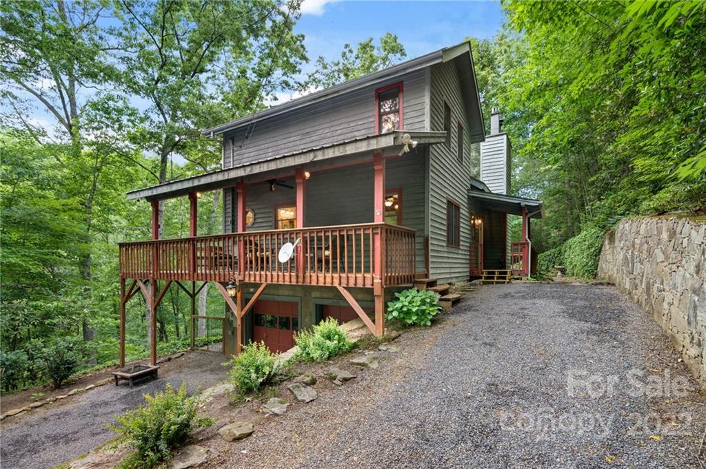 7 Twin Mountain View Road Canton, NC 28716 - Photo 1 of 36 a front view of a house with garden