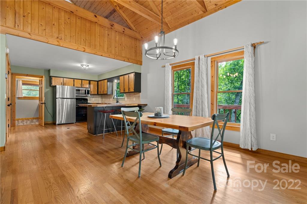 7 Twin Mountain View Road Canton, NC 28716 - Photo 12 of 36 a dining room with a wooden table and chairs