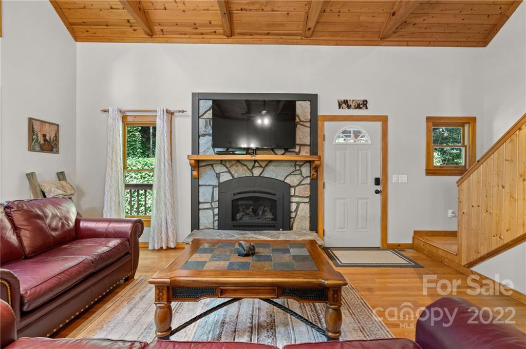 7 Twin Mountain View Road Canton, NC 28716 - Photo 14 of 36 a living room with furniture and a fireplace