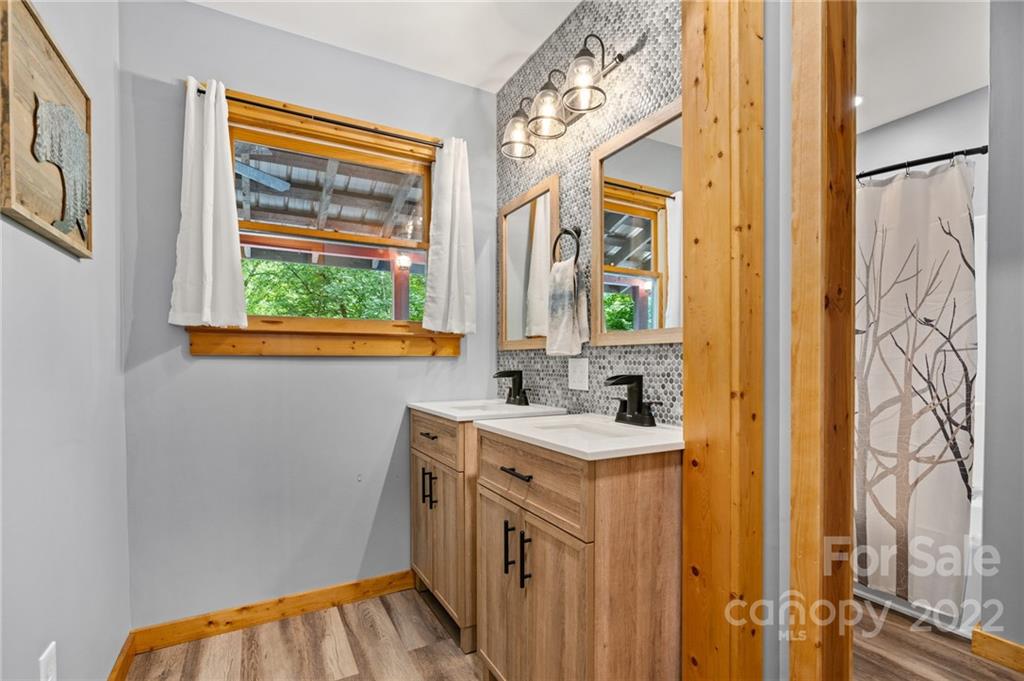 7 Twin Mountain View Road Canton, NC 28716 - Photo 22 of 36 a bathroom with a sink a vanity and a window