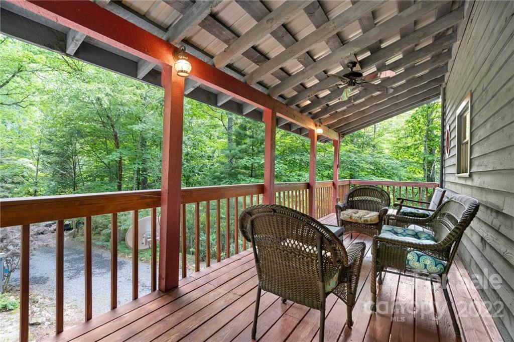 7 Twin Mountain View Road Canton, NC 28716 - Photo 3 of 36 a view of a patio with furniture and wooden floor