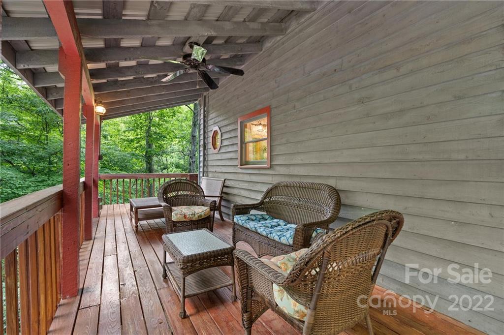7 Twin Mountain View Road Canton, NC 28716 - Photo 4 of 36 a view of a chairs and table in the balcony