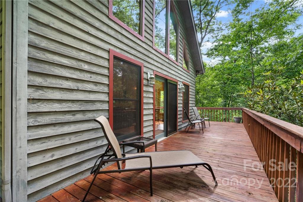 7 Twin Mountain View Road Canton, NC 28716 - Photo 5 of 36 a view of balcony with wooden floor and outdoor seating