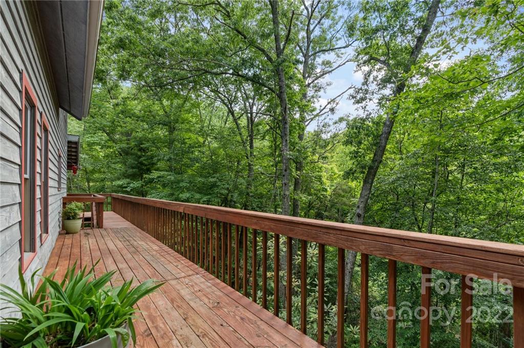 7 Twin Mountain View Road Canton, NC 28716 - Photo 7 of 36 a balcony with wooden floor and outdoor space