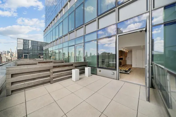 a living room with furniture and windows