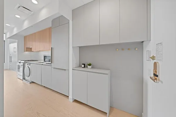 a spacious bedroom with a large bed and a couch