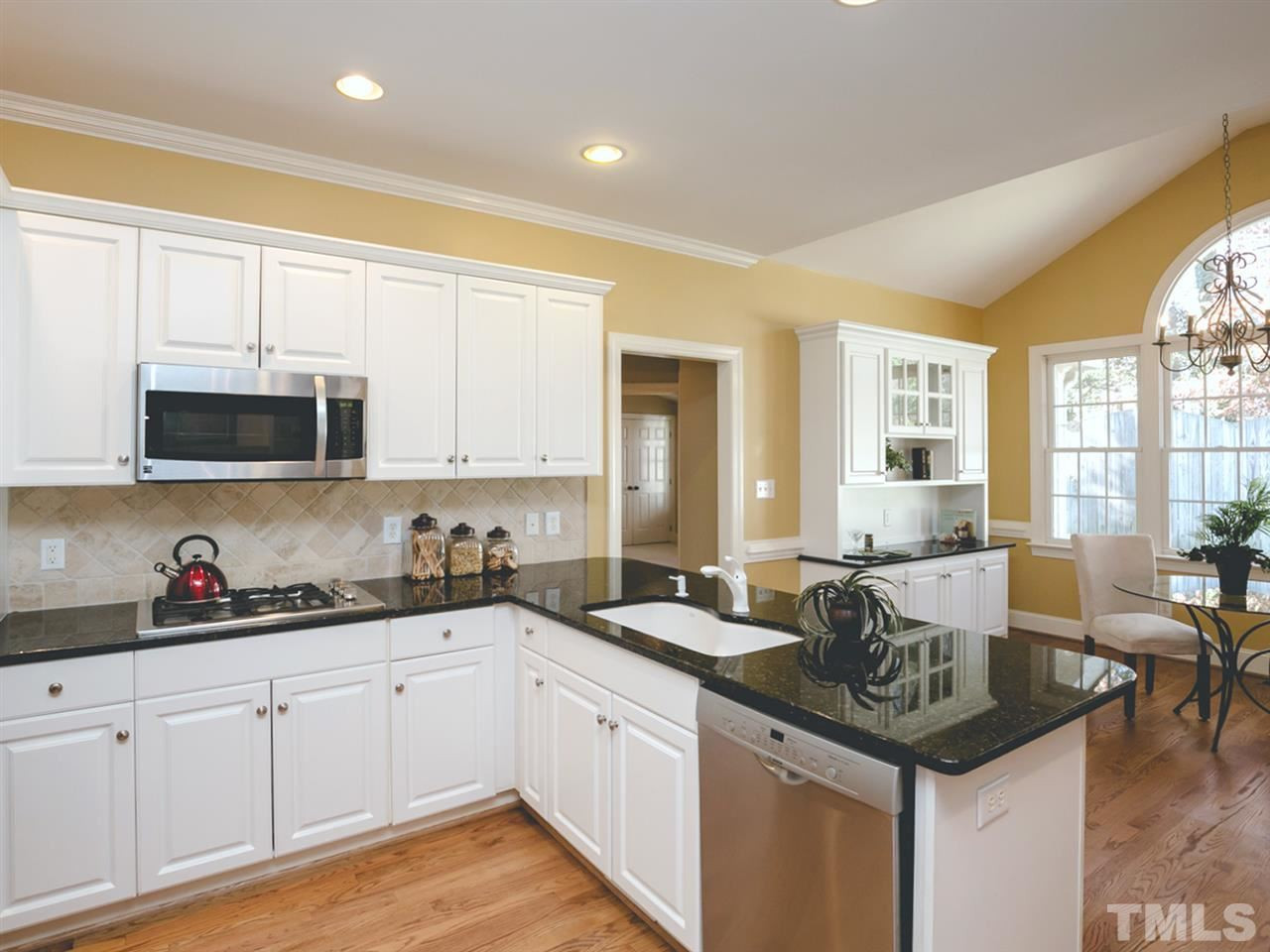 7909 Ridge Pointe Lane Raleigh, NC 27615 - Photo 10 of 25 Kitchen with granite and stainless steel appliances