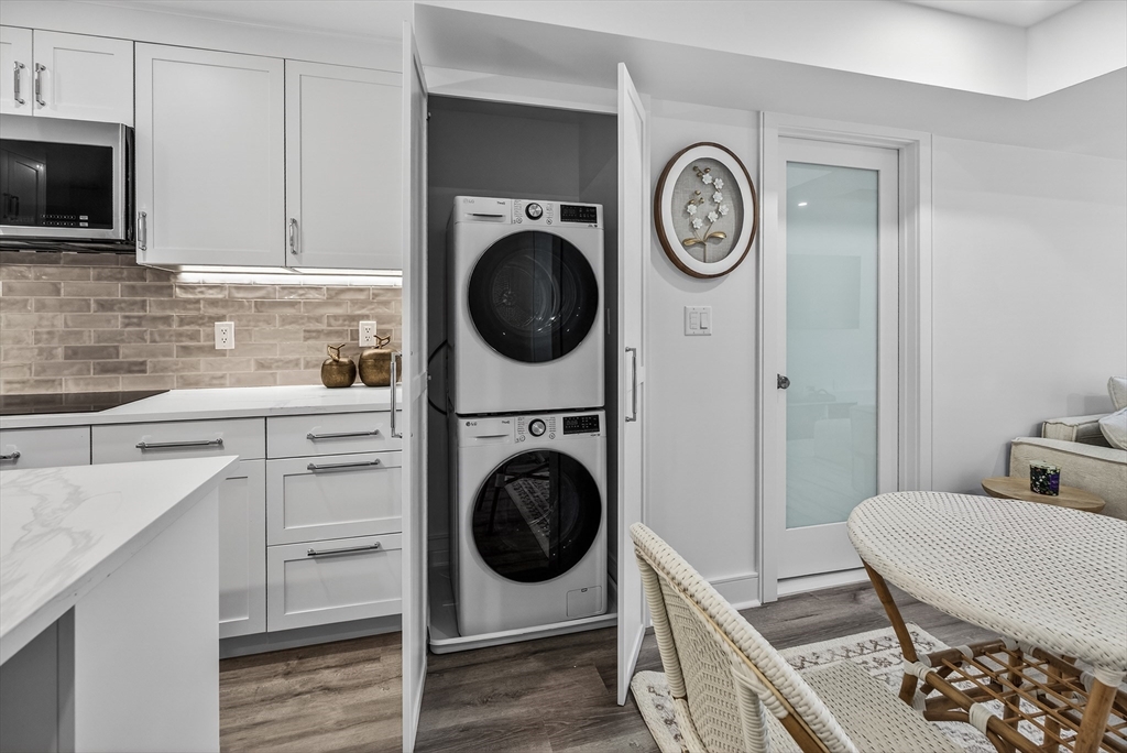 149 Charles Street, Unit 4 Boston, MA 02114 - Photo 4 of 11 a view of a kitchen with washer and dryer