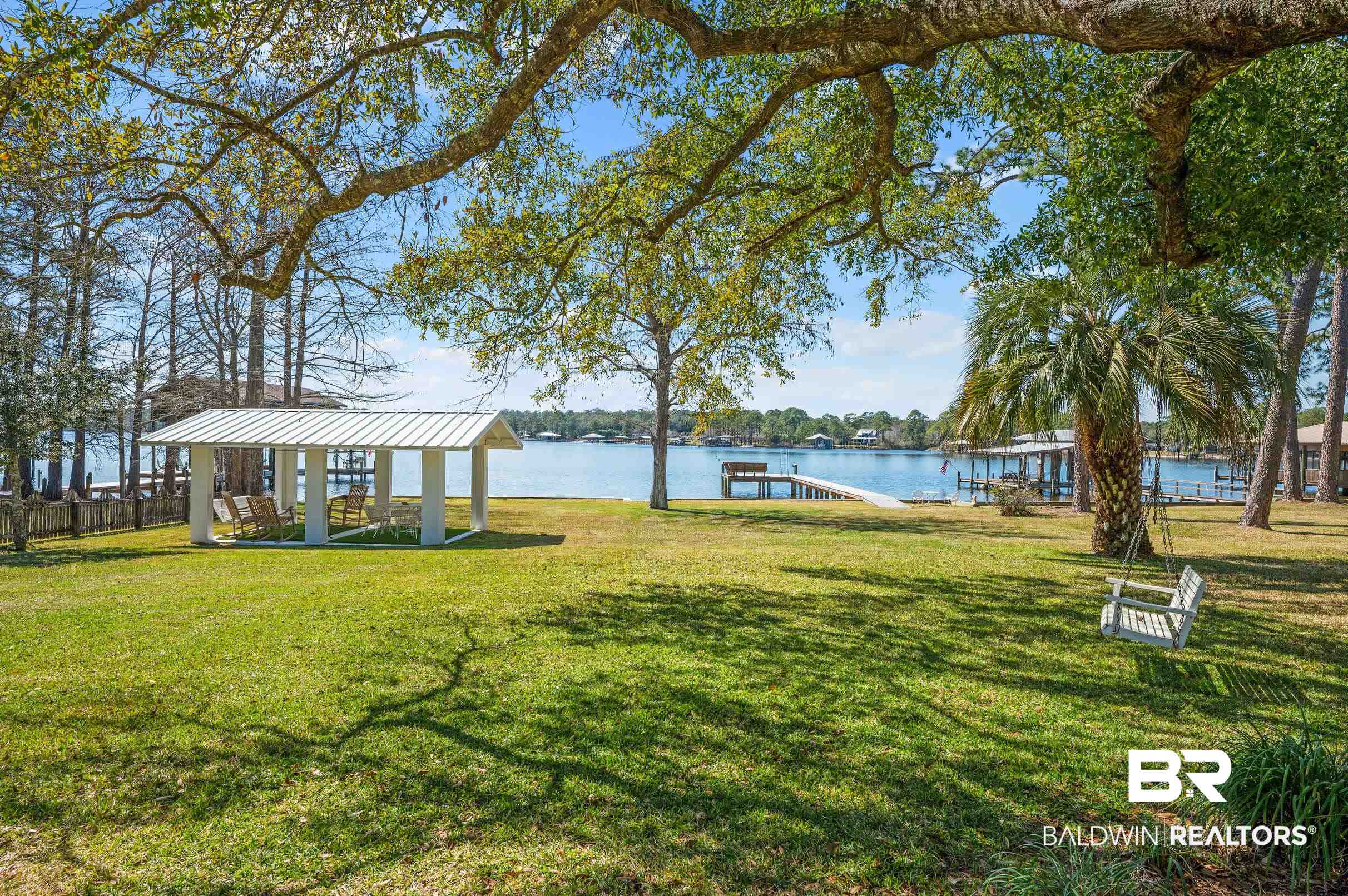 9459 Soldier Creek Road Lillian, AL 36549 - Photo 28 of 54 View of yard featuring a gazebo, a dock, and a water view