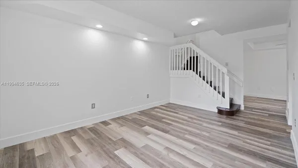 a view of entryway with wooden floor
