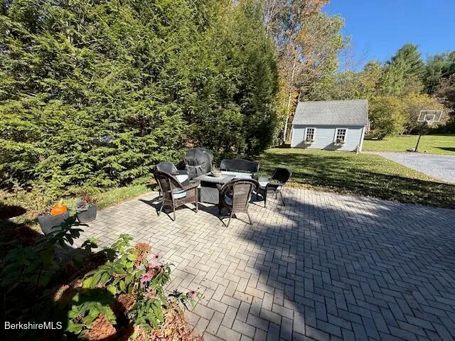 a view of a backyard with sitting area