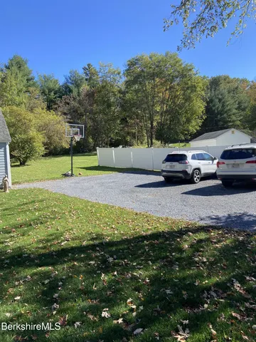 a view of a yard with a car park