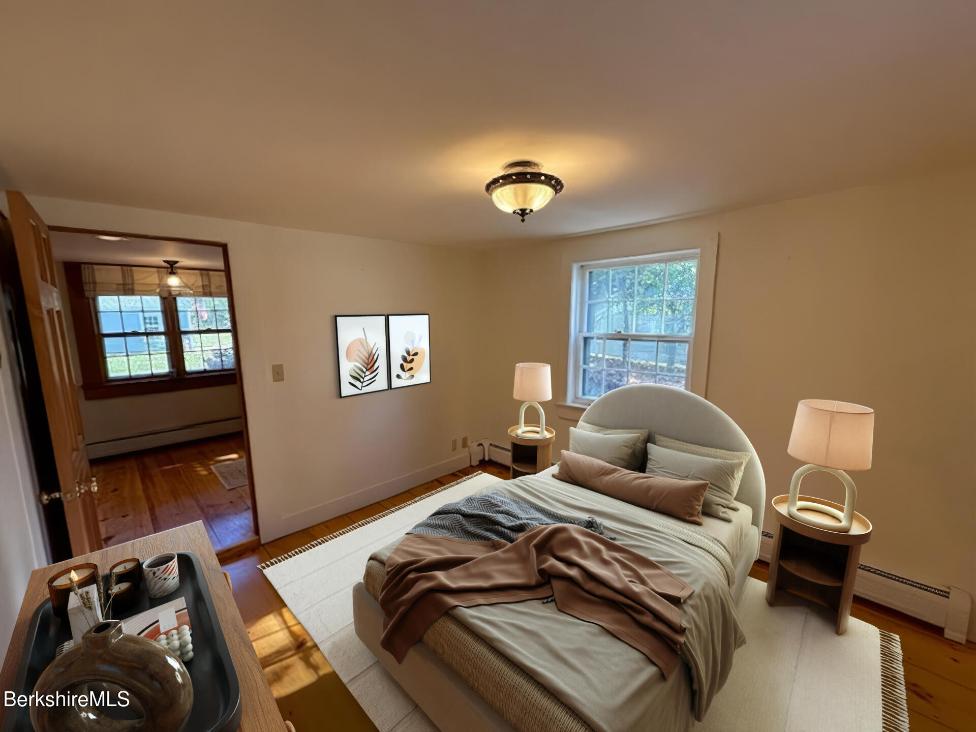 910 North Hoosac Road Williamstown, MA 01267 - Photo 7 of 22 a bedroom with a bed and wooden floor