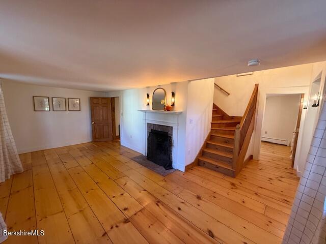 910 North Hoosac Road Williamstown, MA 01267 - Photo 8 of 22 a view of a livingroom with wooden floor and staircase