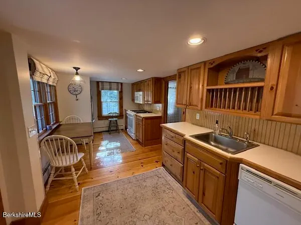 a kitchen with wooden cabinets and a sink