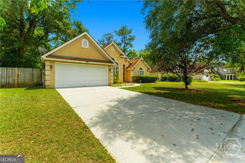 10 Fox Hound Court Pooler, GA 31322 - Photo 2 of 32 a front view of house with yard and green space