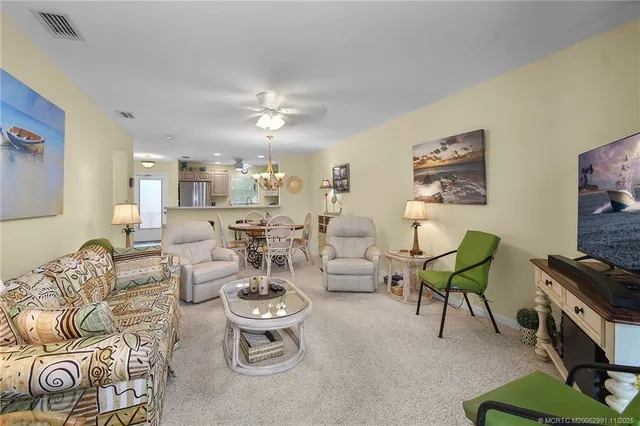 a living room with lots of furniture and a flat screen tv