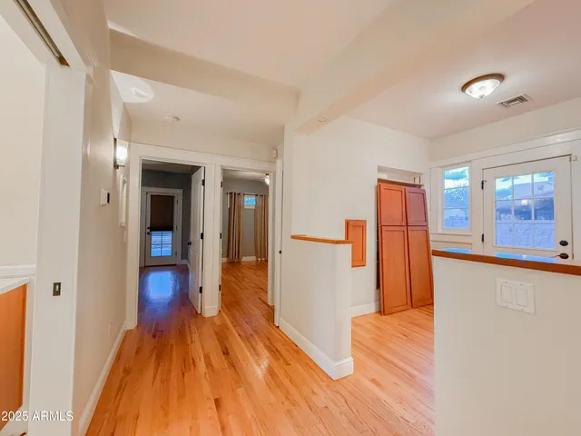 a view of a living room with wooden floor