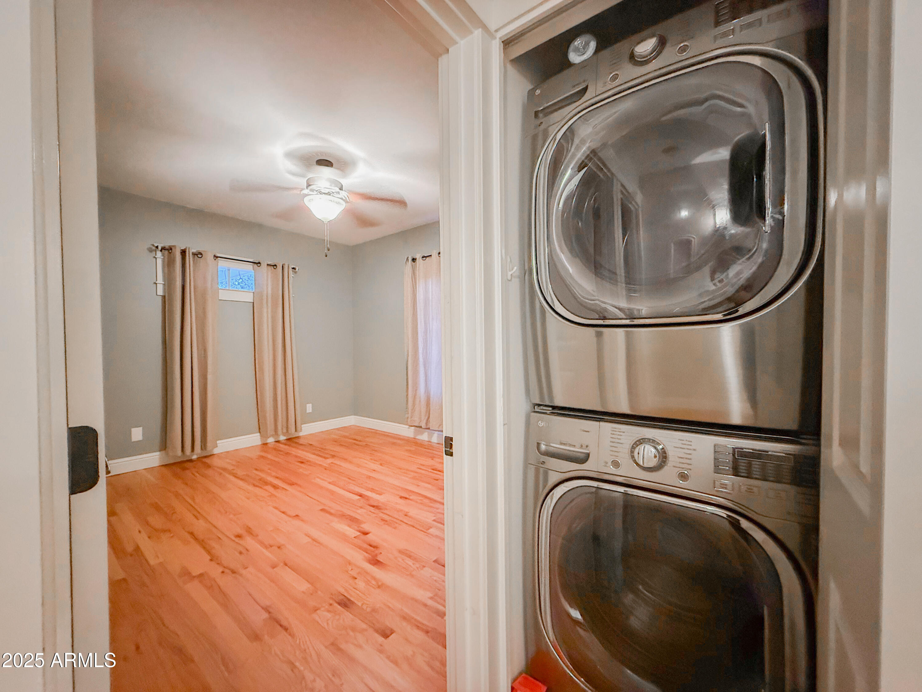56 East Vernon Avenue Phoenix, AZ 85004 - Photo 13 of 29 a view of a bedroom with washer and dryer