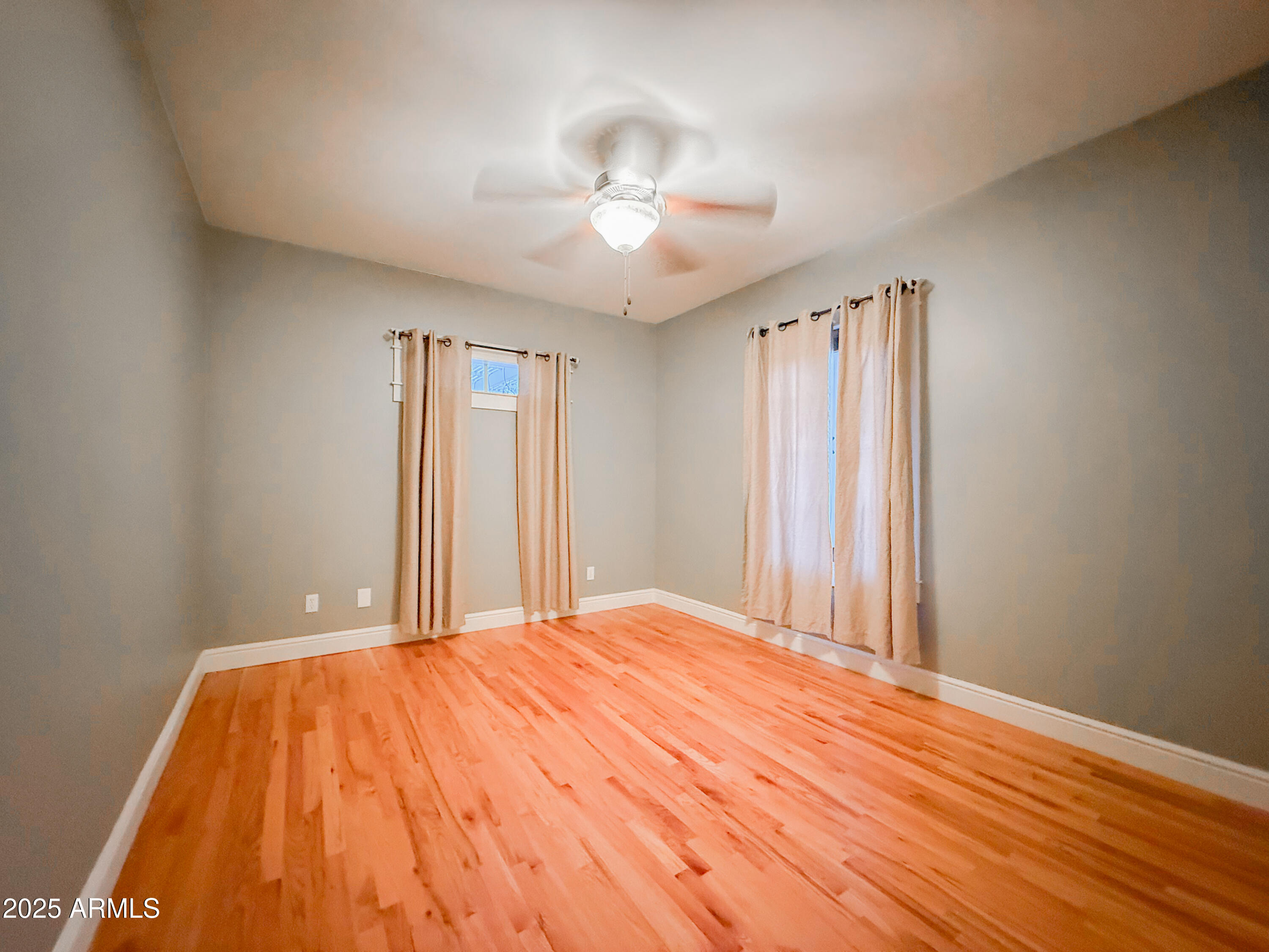 56 East Vernon Avenue Phoenix, AZ 85004 - Photo 14 of 29 a bedroom with a bed and a chandelier