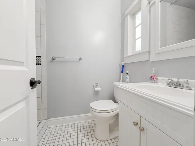 a bathroom with a sink toilet and vanity