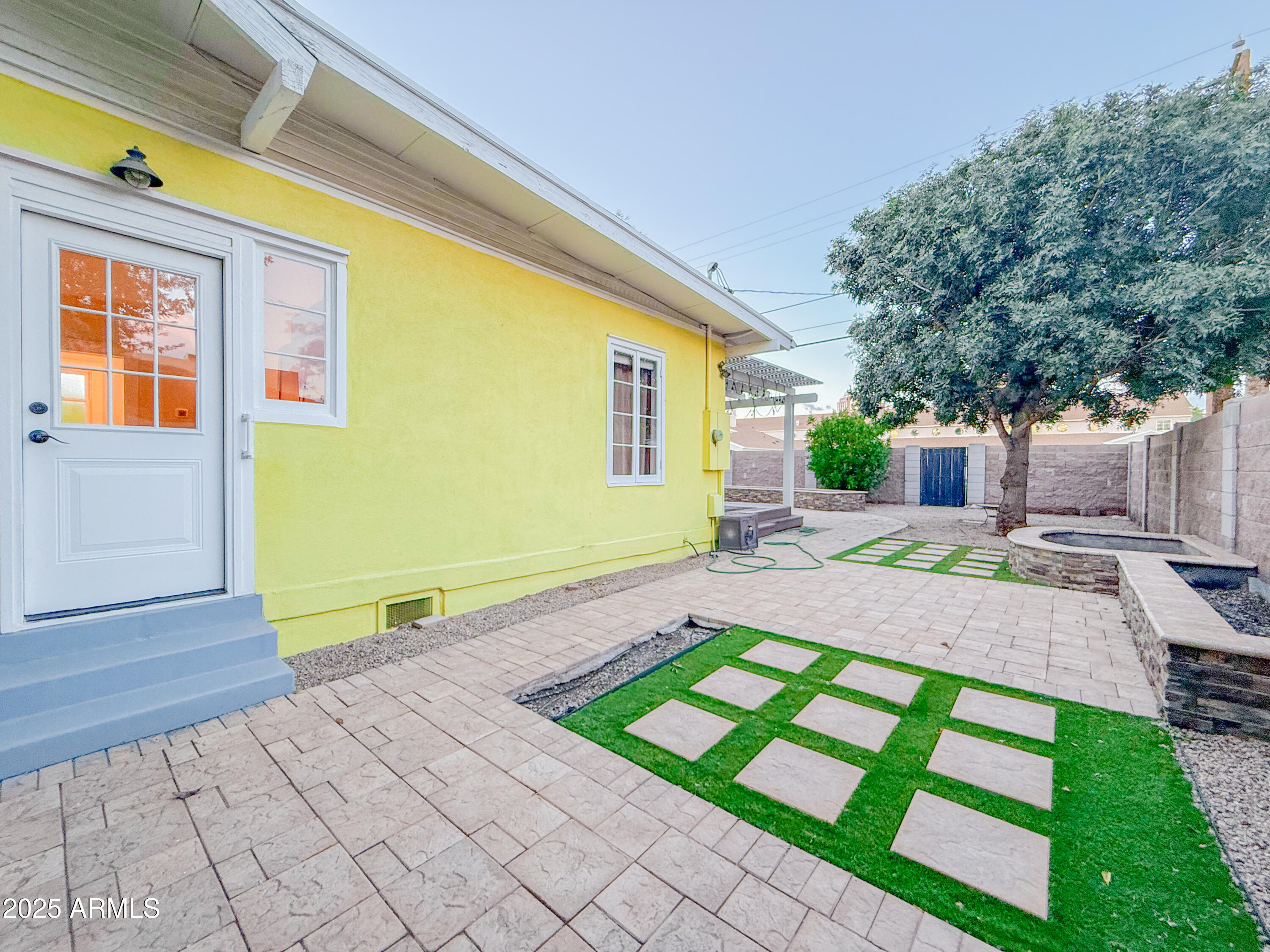 56 East Vernon Avenue Phoenix, AZ 85004 - Photo 22 of 29 a front view of a house with a yard