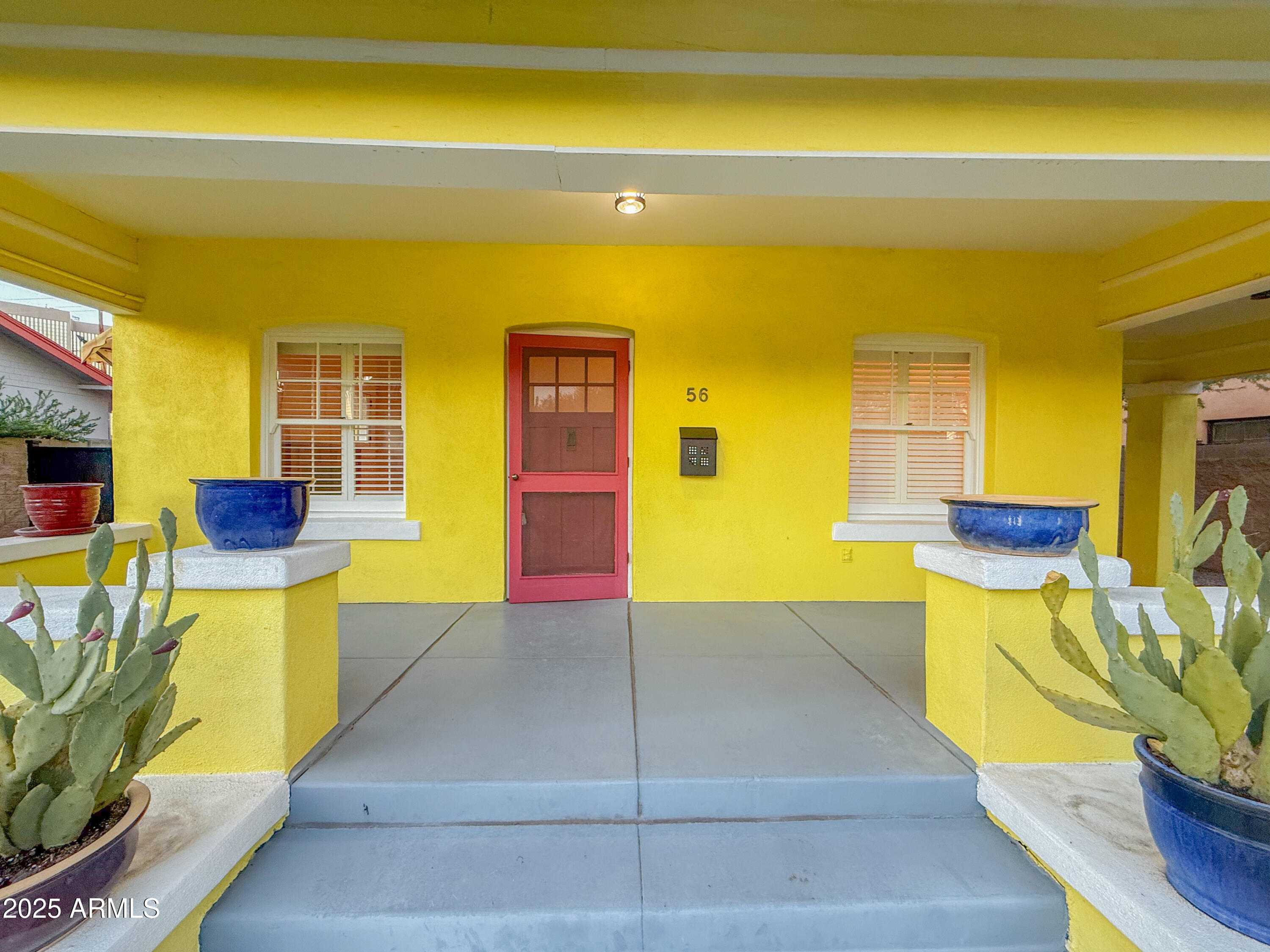 56 East Vernon Avenue Phoenix, AZ 85004 - Photo 5 of 29 a view of a swimming pool with chairs