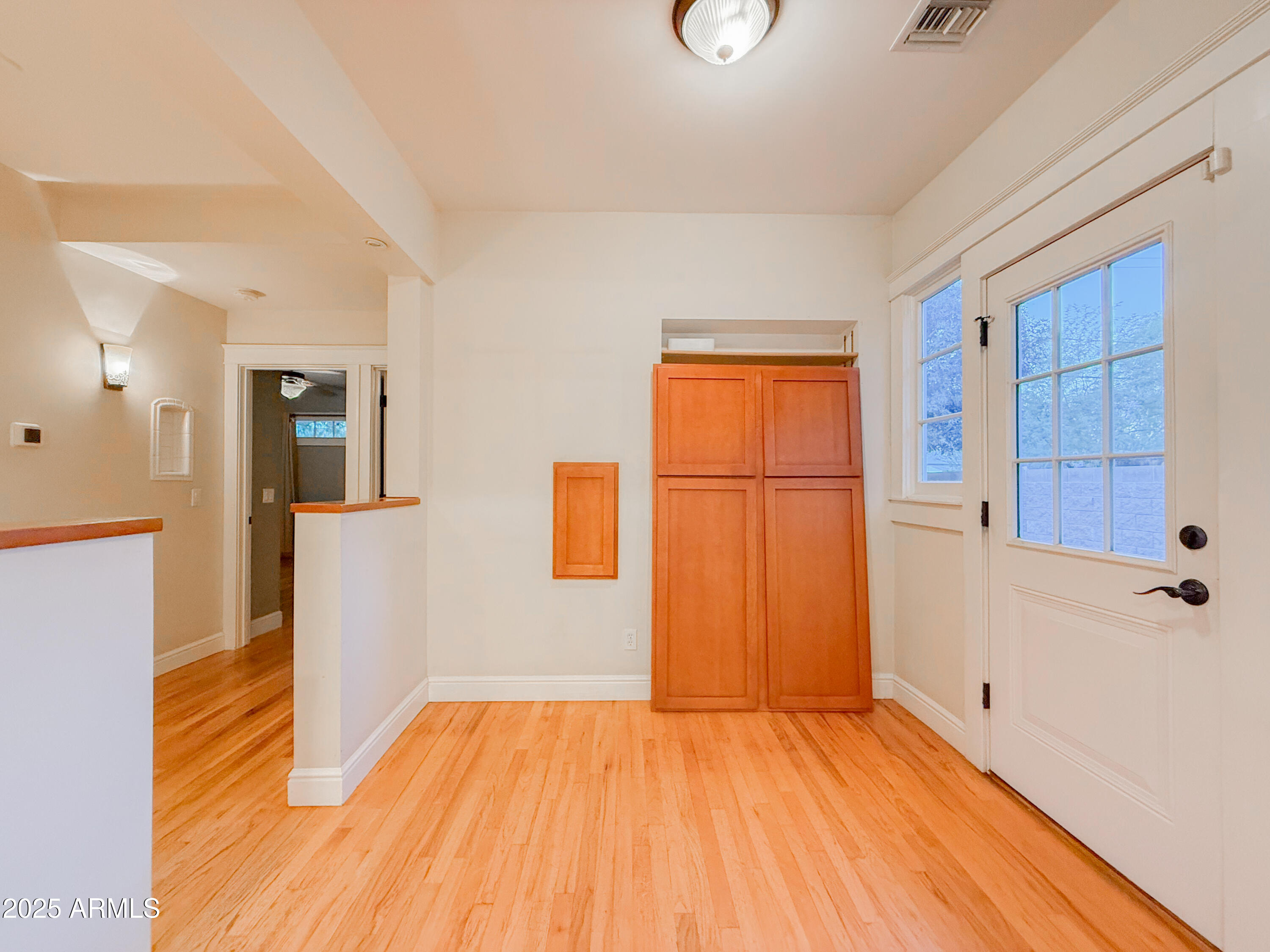 56 East Vernon Avenue Phoenix, AZ 85004 - Photo 10 of 29 a view of a room with wooden floor and cabinet