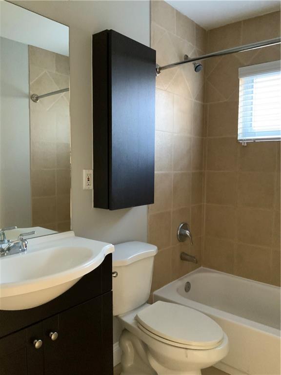 805 Piedmont Avenue Northeast, Unit 5 Atlanta, GA 30308 - Photo 7 of 12 a bathroom with a sink a toilet and shower