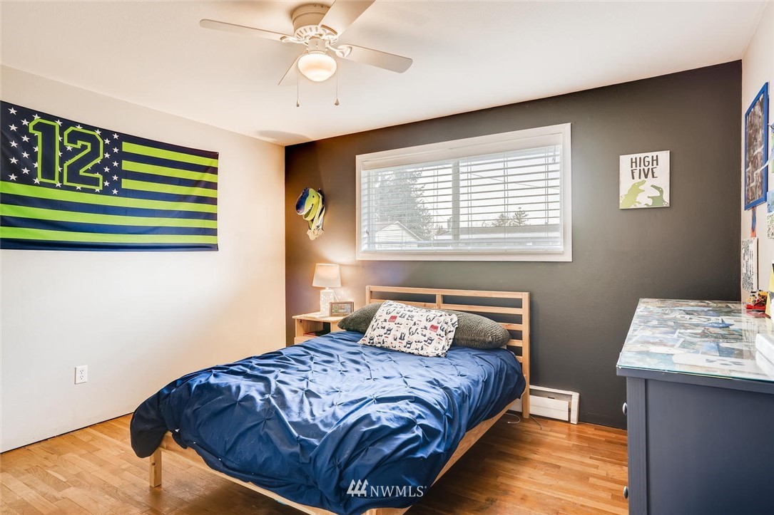 17810 98th Avenue South Renton, WA 98055 - Photo 14 of 28 a bedroom with a bed and a window