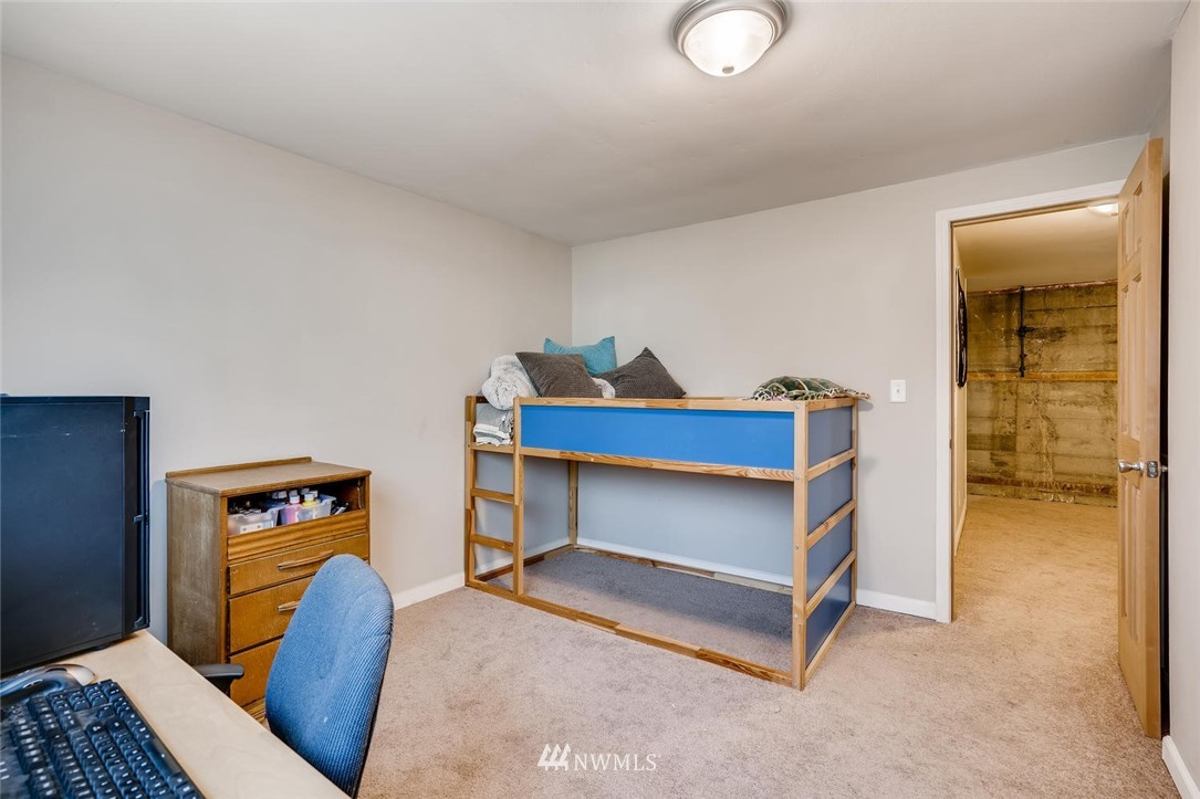 17810 98th Avenue South Renton, WA 98055 - Photo 19 of 28 a bedroom with furniture and a lamp