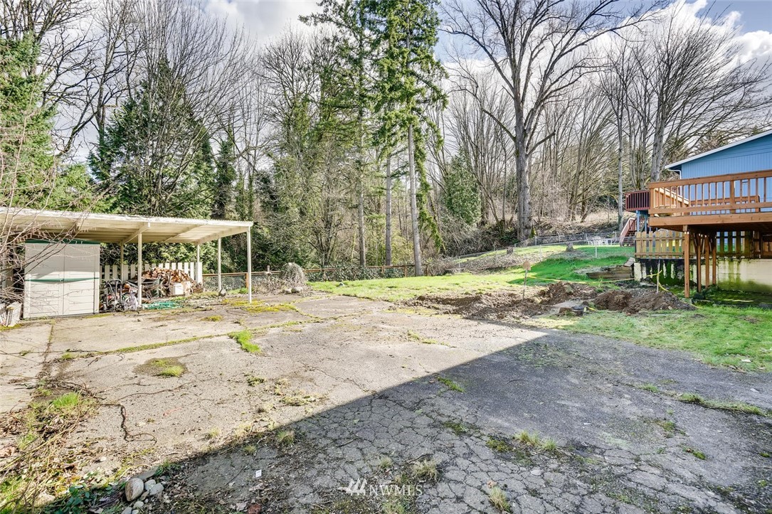 17810 98th Avenue South Renton, WA 98055 - Photo 24 of 28 a view of a yard with a house and large trees