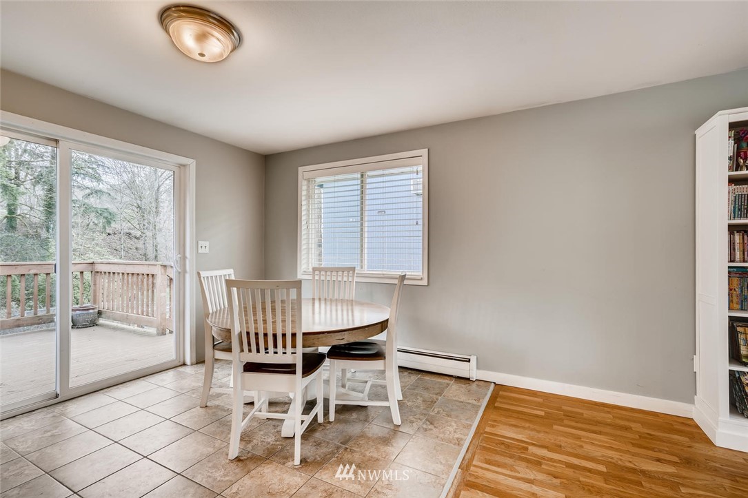 17810 98th Avenue South Renton, WA 98055 - Photo 6 of 28 a dining room with wooden floor and a window