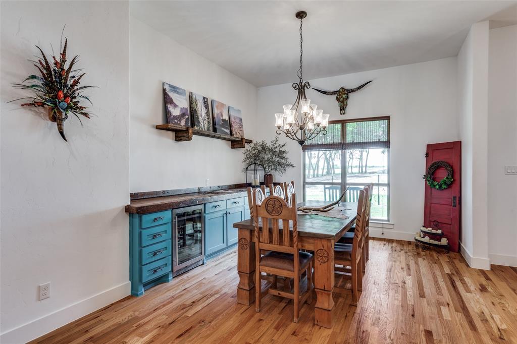626 Lone Tree Road Nevada, TX 75173 - Photo 12 of 40 a view of a dining room with furniture window and wooden floor